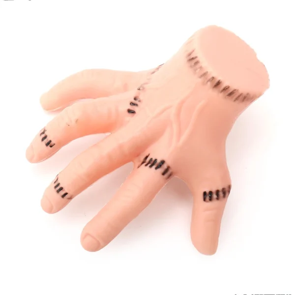 Boieo severed hand hair clip, skin-tone plastic hand with black stitch marks