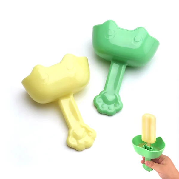 Two Inxens cat-shaped popsicle holders in yellow and green