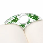 Olen thumb page holder in clear resin with deep green leaf-style sections